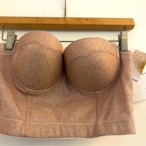 NWT- new w tags. Rosegold sparkly bustier with straps and hook back. Sz Medium